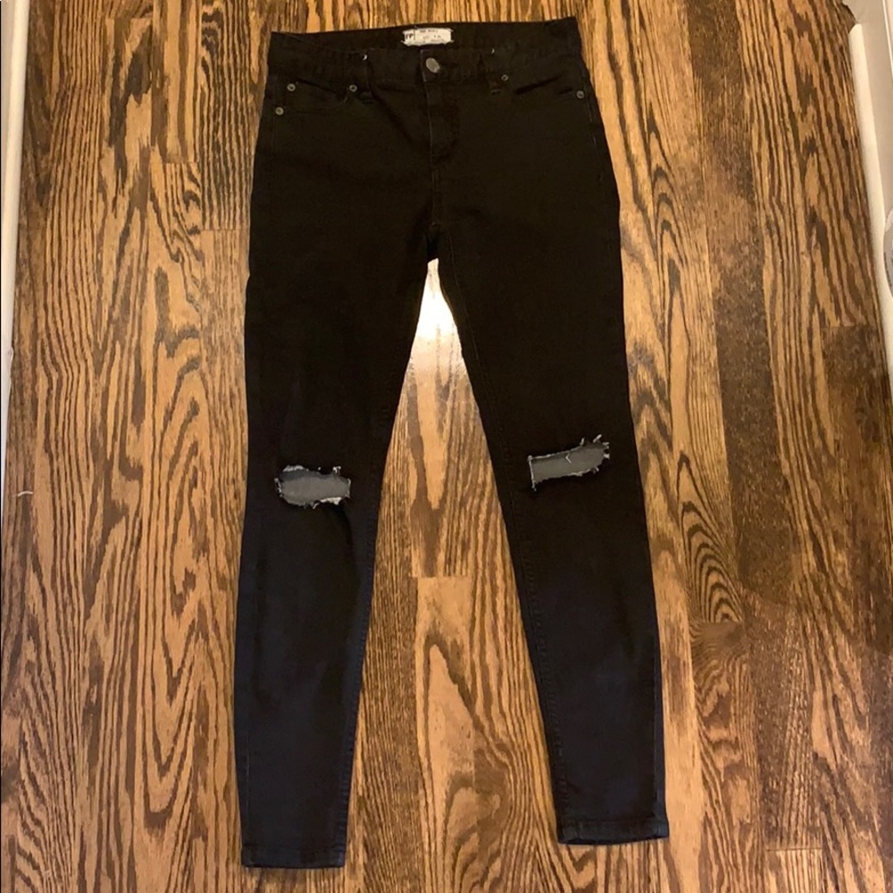 Free People black skinny jeans with holes